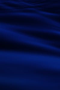 Paradise Part 3 — The Essential Architecture of Continuity Elegant and smooth dark blue wave pattern creating a silky abstract texture.
