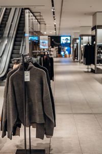 Explore contemporary fashion in this upscale shopping mall's stylish clothing display.