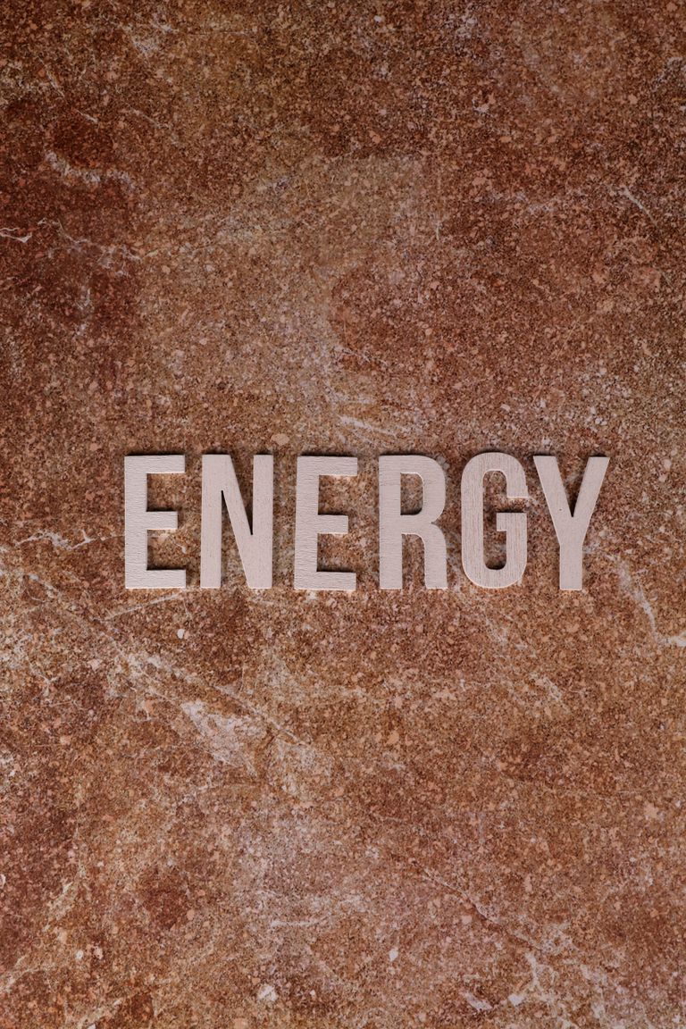 Stylish depiction of the word 'ENERGY' on a brown textured surface. India energy autonomy governance signal
