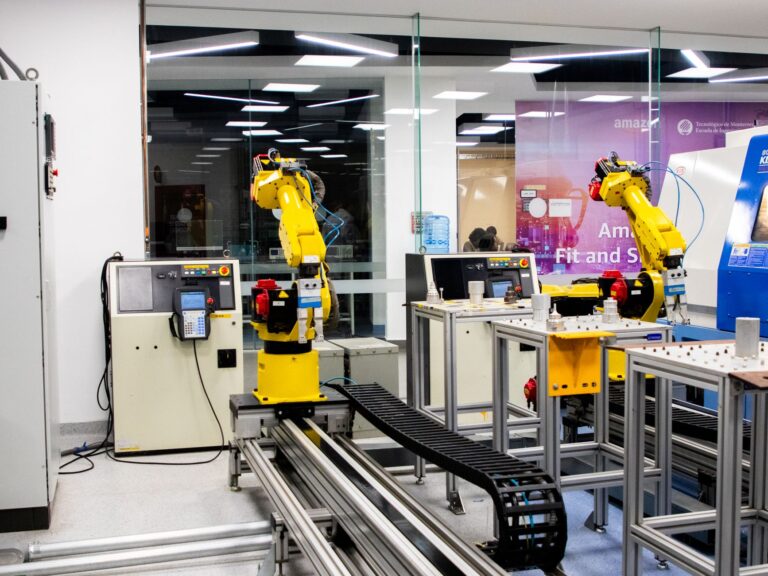 Humanoid robots working inside a factory, representing China’s new humanoid training academy and the rise of embodied AI.