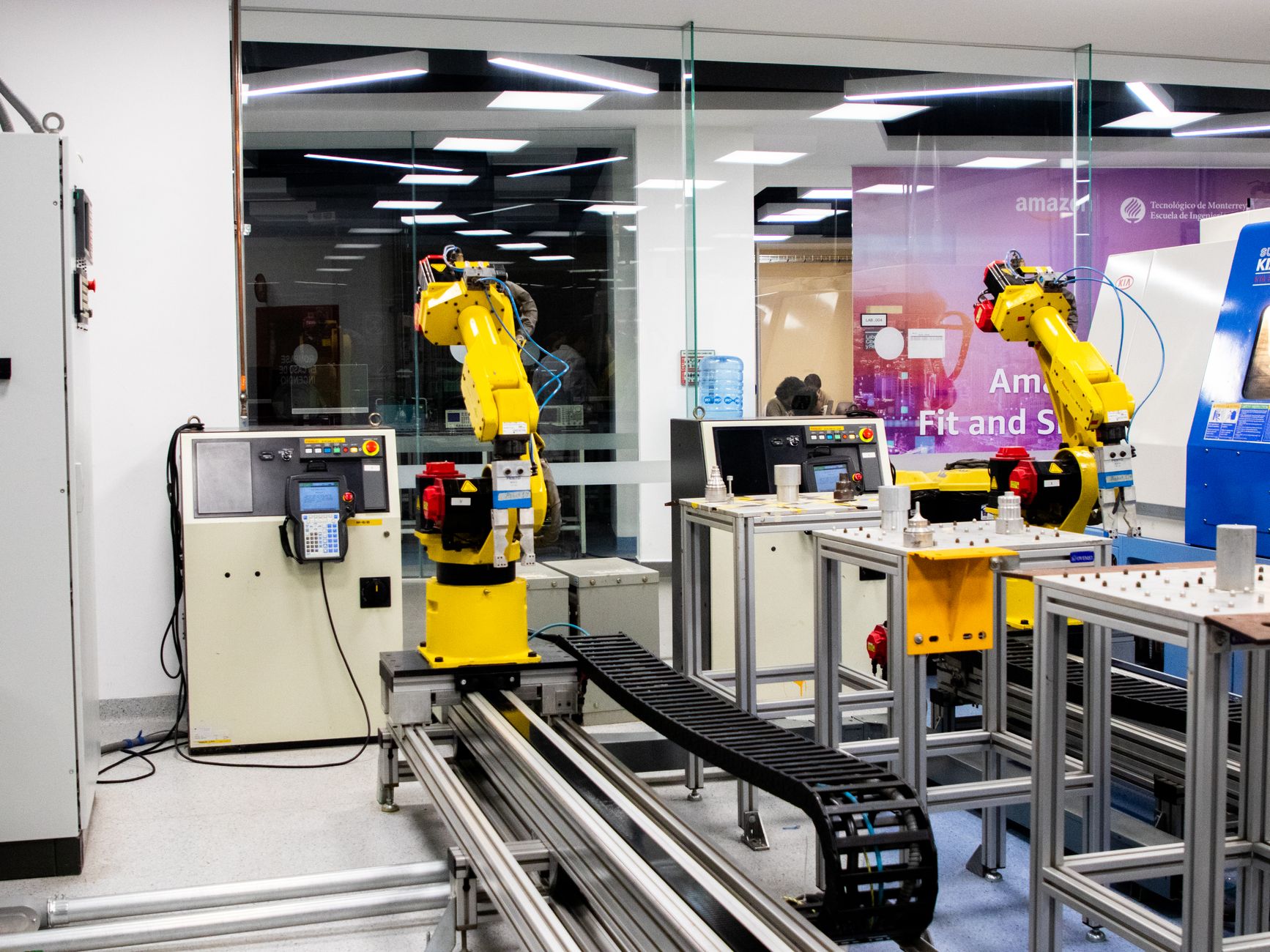 Humanoid robots working inside a factory, representing China’s new humanoid training academy and the rise of embodied AI.